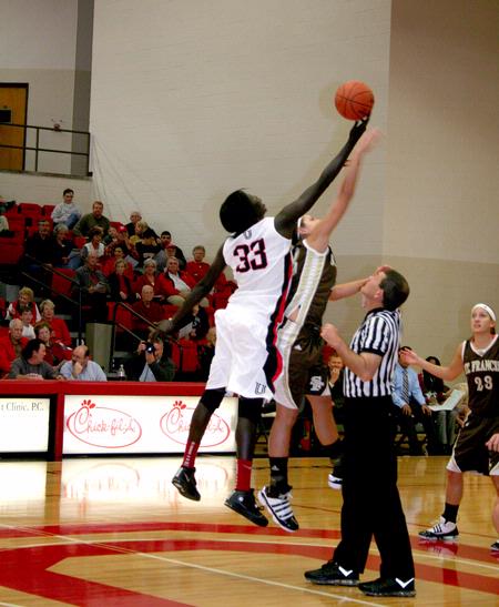 Zeinab "Sarah" Chan hits the ball into Union's possession at the beginning of the homecoming game against University of St. Francis. The Lady Bulldogs won the game 83-57.  - Photo by Deanna Santangelo