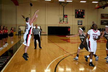 Kayla Hudson shoots for 3 during  the homecoming game against University of St. Francis. The Lady Bulldogs won the game 83-57. - Photo by Deanna Santangelo