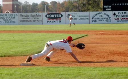 Chris Wright stretches from first base to received the throw from second. - Photo by Steven Aldridge