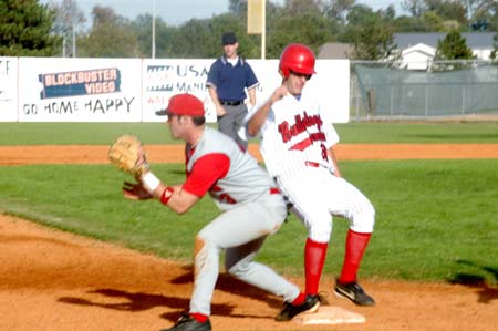Senior pitcher Adam Yates scampers into third just ahead of the throw.  Third baseman Garrett Pepper prepared to get the throw from the outfield. - Photo by Steven Aldridge
