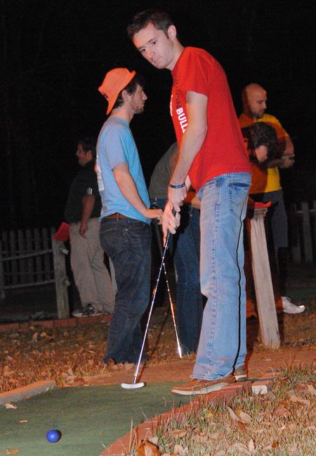 Paul Wilson, sophomore nursing major, plays mini-golf during the Residence Life event, Puttapalooza. - Photo by Victoria Stargel