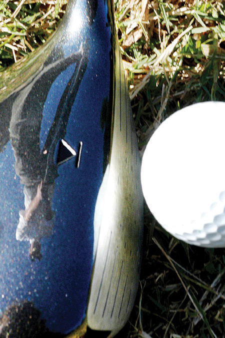 Freshman Chase Whitby focuses on hitting a long drive down the fairway. - Photo by Jonathan Blair