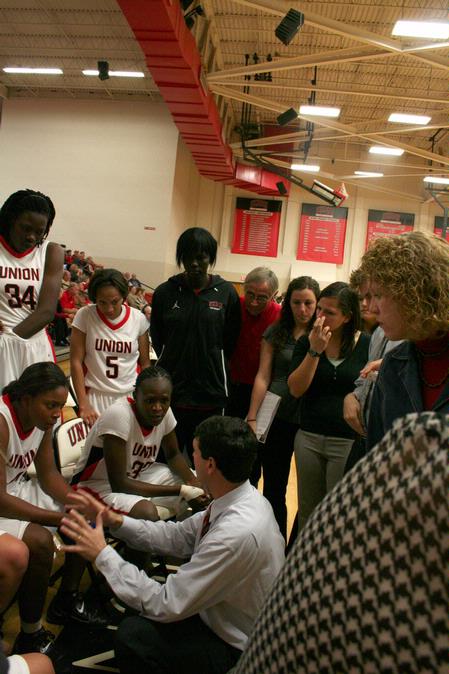 Mark Campbell, head women's basketball coach, encourages players during a time-out in the Rotary Classic game against Oklahoma Baptist University. The Lady Bulldogs advanced to the second round with a win of 76-62. - Photo by Deanna Santangelo
