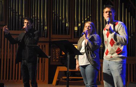 Bradford Carrington, junior church music major, Chelsea Jones, sophomore music major, and Jeremy Isbell, sophomore music major, lead an assortment of hymns during chapel. - Photo by Victoria Stargel