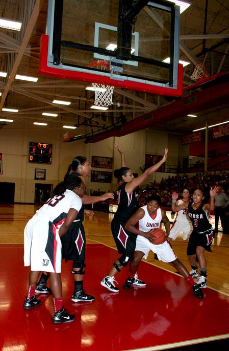 Hope Adams goes in towards the basket for a lay-up during the 2nd round game of the Rotary Classic against Azusa Pacific University. The Lady Bulldogs won the game 61-50. - Photo by Deanna Santangelo
