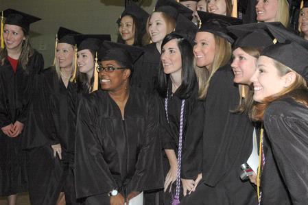 Graduates pose for a photograph before the 2010 Fall Commencement Services.  - Photo by Beth Spain