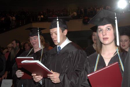 Graduates Mary Annis, Jordan Buie, and Sara Chinery, sing the Alma Mater at the close of the 2010 Fall Commencement Ceremonies.  - Photo by Beth Spain