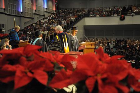 David S. Dockery, president of the university, confers degrees to graduates of Union University. - Photo by Morris Abernathy