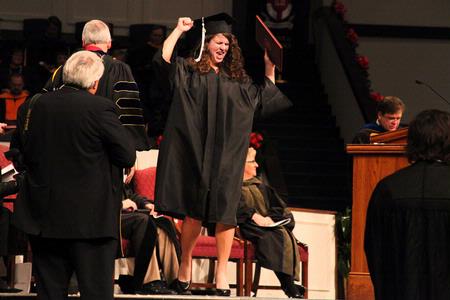 Jana Lawson, TESL major, celebrates receiving her diploma at the 2010 Fall Commencement Services.   - Photo by Kristi McMurry Woody