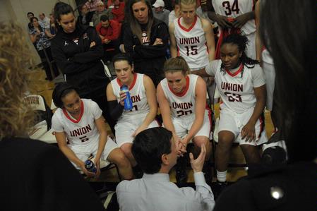 Coach Mark Campbell talks to the Lady Bulldogs during a time out in the game against Bethel University.  - Photo by Morris Abernathy