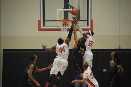 The Bulldogs battle for the ball against Bethel University. The Bulldogs won the game 77-75. - Photo by Morris Abernathy