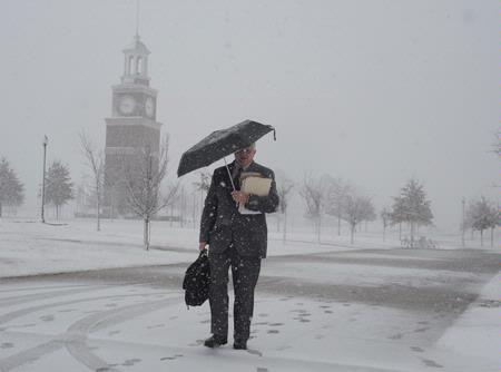 Dr. Randall Bush, professor of Christian thought & tradition, makes his way to class during a heavy snowfall. - Photo by Morris Abernathy
