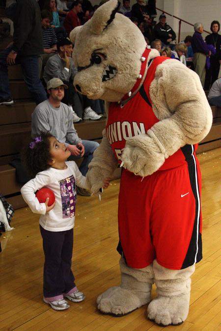Buster the Bulldog chats with a young basketball fan at the Lady Bulldogs' game against Bethel University.  - Photo by Ebbie Davis