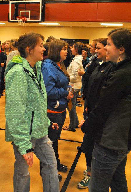 Beth Williams, senior special education major, and Rebecca Eaton, senior mathematics major, catch up at the the annual Holla Back party.  - Photo by Victoria Stargel