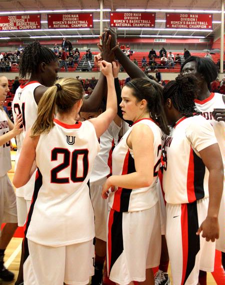 The Lady Bulldogs gather to celebrate after their win against Bethel University, 81-62.
 - Photo by Ebbie Davis