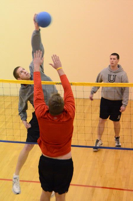 Students play intramural wall ball in the racquetball courts.  - Photo by Beth Spain