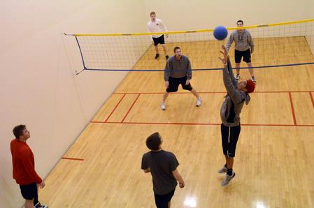 Students play intramural wall ball in the racquetball courts.  - Photo by Beth Spain
