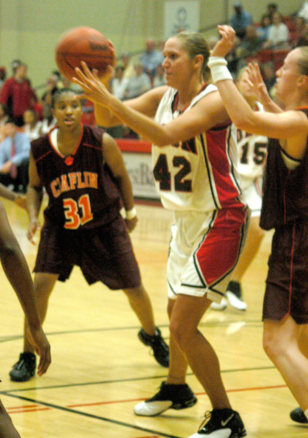 Ginger Bryant (42) kicks the ball out to the perimeter during a 91-64 win over Claflin University. - Photo by Courtney Ross