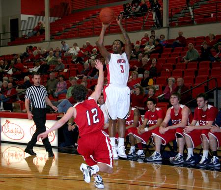 CJ Davis shoots a 3-pointer during the game against Lyon College. - Photo by Deanna Santangelo