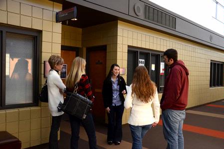Lily Coursey, sophomore elementary ed. major, gives a tour to a visiting group of prospective students. She explains all the different ways they can get involved in student life organizations.  - Photo by Ebbie Davis