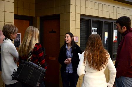 Lily Coursey, sophomore elementary ed. major, gives a tour to a visiting group of prospective students. She explains all the different ways they can get involved in student life organizations.  - Photo by Ebbie Davis