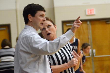 Mark Campbell, head women's basketball coach, discusses a call with the referee during a game against Lyon College, which the Lady Bulldogs won 65-44. - Photo by Beth Spain
