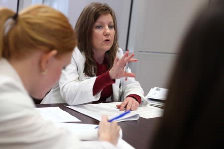 Kimberly Lindsey, assistant professor of pharmacy practice, meets with students in a small group room in Providence Hall. - Photo by Kristi McMurry Woody
