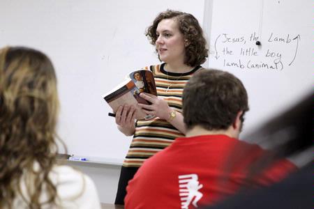 Janna Chance, assistant professor of English, discusses a William Blake poem with her students in class.  - Photo by Kristi McMurry Woody