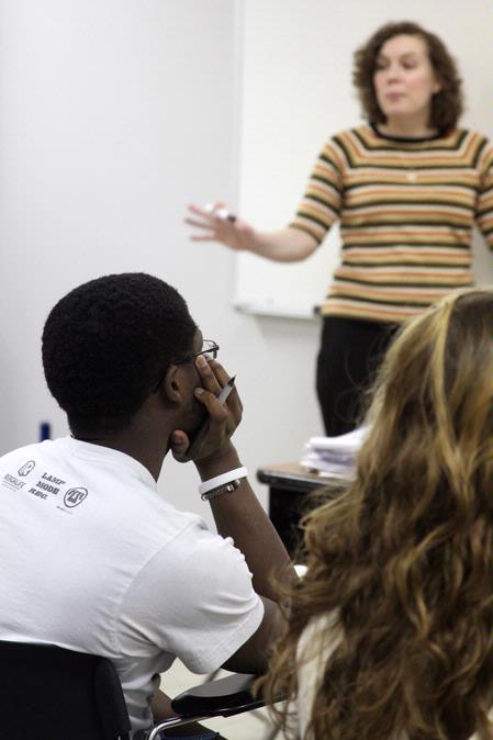 Students listen as Janna Chance, assistant professor of English, discusses a William Blake poem with them. - Photo by Kristi McMurry Woody