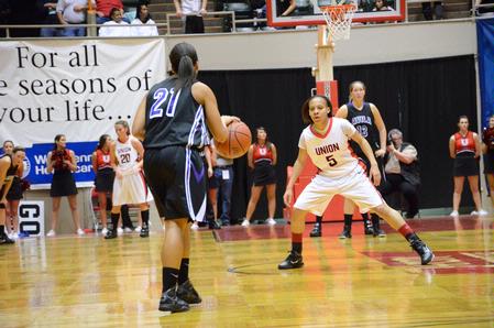 LaTesa McLaughlin guards her Avila University opponent during the first game of the NAIA National Championship. - Photo by Abigail Harris