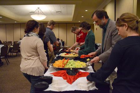 Faculty, staff, and students enjoy the line of hor d'oeuvers provided by Aramark at the "Hoping to Live Forever" lectures in the Carl Grant Center. - Photo by Abigail Harris