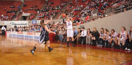 Kayla Bryant takes and makes a three pointer in game one of the NAIA National Championship. - Photo by Morris Abernathy