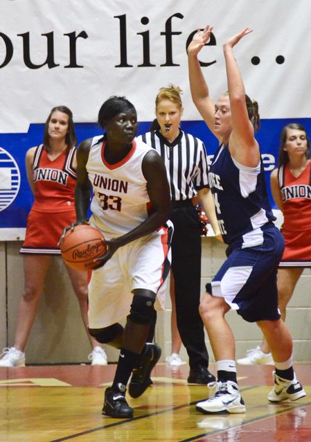 Zeinab Chan looks for an opening to shoot in the semifinals game of the NAIA National Championship. - Photo by Beth Spain