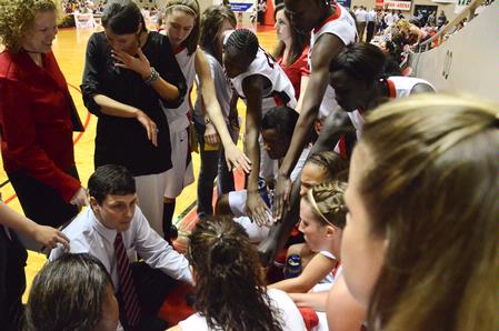 Mark Campbell, head coach, talks to the Lady Bulldogs toward the end of the semifinals game of the NAIA National Championship. - Photo by Beth Spain