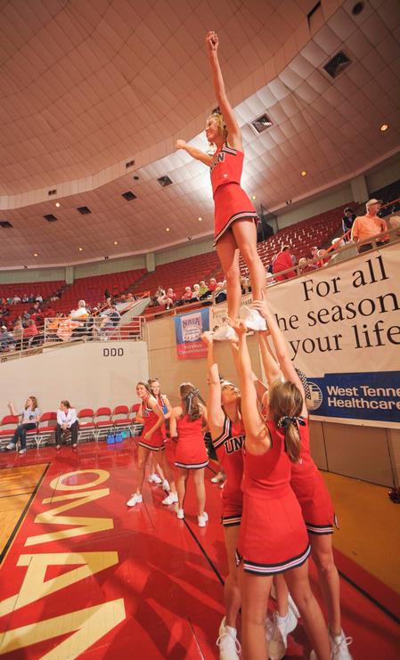 The cheerleaders warm up before the semifinals game of the NAIA National Championship. - Photo by Morris Abernathy