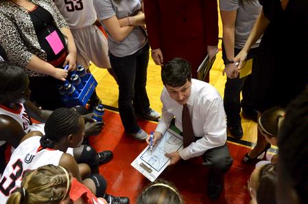 Coach Campbell goes over a play with his team during a time-out.  - Photo by Beth Spain