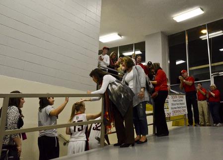 Waiting fans cheer and applaud the Lady Bulldogs after their 65–59 loss to Azusa Pacific at the NAIA National Championship. - Photo by Beth Spain