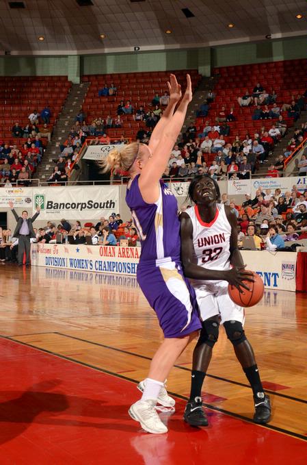Zeinab Chan moves in for a shot while her Westminster College opponent attempts to block her in the quarterfinals of the NAIA National Championship. The Lady Bulldogs advanced to the semifinals with a win of 78-61. - Photo by Morris Abernathy