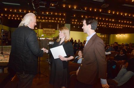 Odd Hynnekleiv, Penelope Film, hands Rachael Kapavik, alum, and Tyler Litton, senior digital media studies major, the certificate for best screenplay for their film <em>Enough</em> in the Student Film Festival 2011. - Photo by Victoria Stargel
