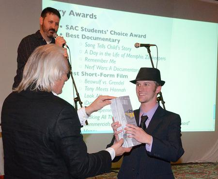 Odd Hynnekleiv, Penelope Film, hands Ben Haws, sophomore media communications major, the award for best documentary for his film <em>Nerf Wars: a Documentary</em> at Student Film Festival 2011. - Photo by Victoria Stargel