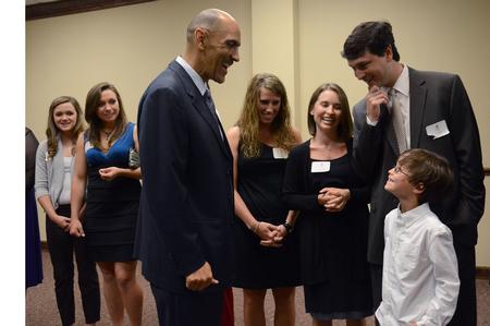 Tony Dungy, Super Bowl winning coach, visits with Mark Campbell, women's basketball coach, and his family. - Photo by Abigail Harris