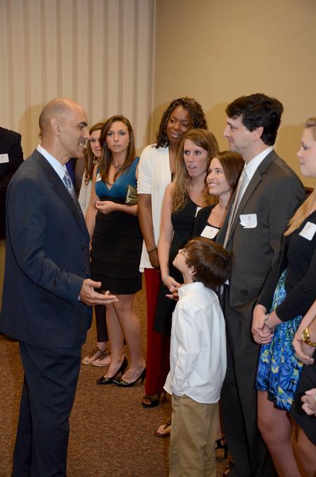 Mark Campbell (right), women's basketball coach, speaks with Super Bowl winning coach, Tony Dungy, who was the keynote speaker at Union's annual Roy L. White Golf and Gala event at the Carl Perkins Civic Center. - Photo by Ebbie Davis