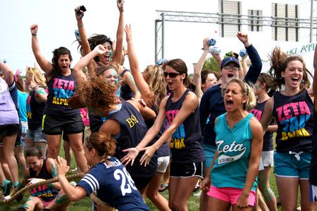 The women of Zeta Tau Alpha cheer for their sisters who just won the rope pull competition at Greek Olympics. - Photo by Deanna Santangelo