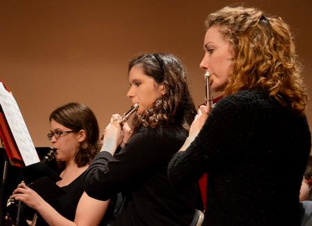 Hannah Crossett (left), junior psychology major, Rachel Robbins, freshman music major, and Emily Hughes, sophomore nursing major, play as the Union University Symphonic Band gives their Spring Concert in the Savage Memorial Chapel.  - Photo by Victoria Stargel