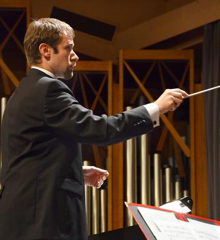 Daniel Musselman conducts "1,200 Mile to Santa Fe", an original piece, as the Union University Symphonic Band gives their Spring Concert in the Savage Memorial Chapel.  - Photo by Victoria Stargel