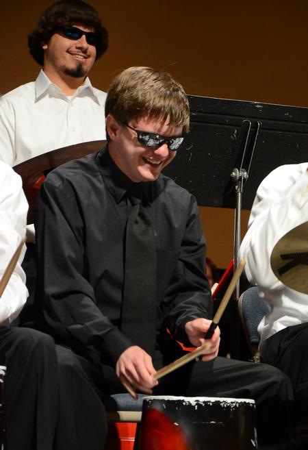 Landon Nipp, sophomore math major, enjoys playing "Mr. Bucket" as the Union University Symphonic Band gives their Spring Concert in the Savage Memorial Chapel.  - Photo by Victoria Stargel