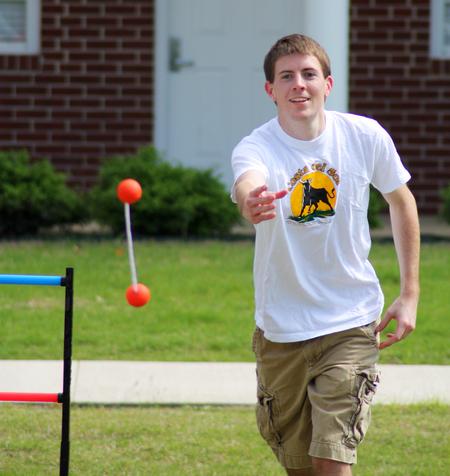 Zachary Key, junior medical technology major, participates in May Day games outside the Bowld Student Commons. - Photo by Zac Calvert