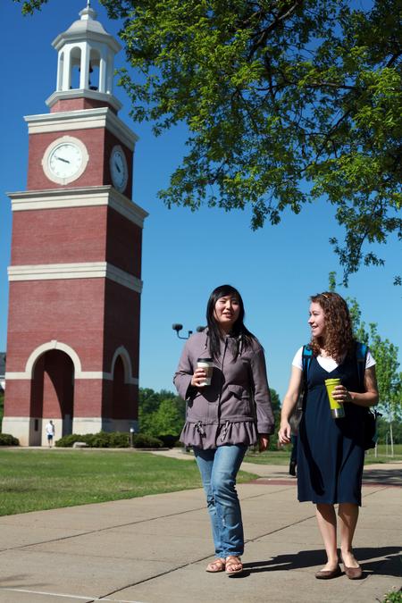 Shinae Giffin and Katherine Crutcher, junior art majors, walk across campus after their class in Jennings Hall.   - Photo by Kristi McMurry Woody
