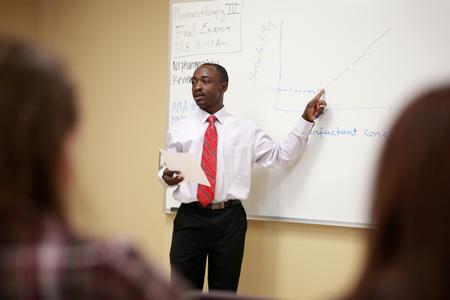 Richard Addo, associate professor of pharmacy, reviews his students for the final exam.  - Photo by Kristi McMurry Woody
