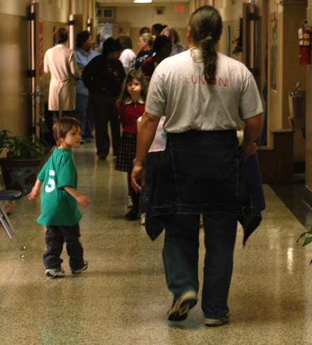 Union English professor David Malone helped at Parkview Montessori where his son (left) attends during Day of Remembrance 2003. - Photo by Jonathan Blair
